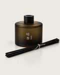 ANKO reed diffuser by Mittsu Doru – frosted amber bottle with black cap and black reeds