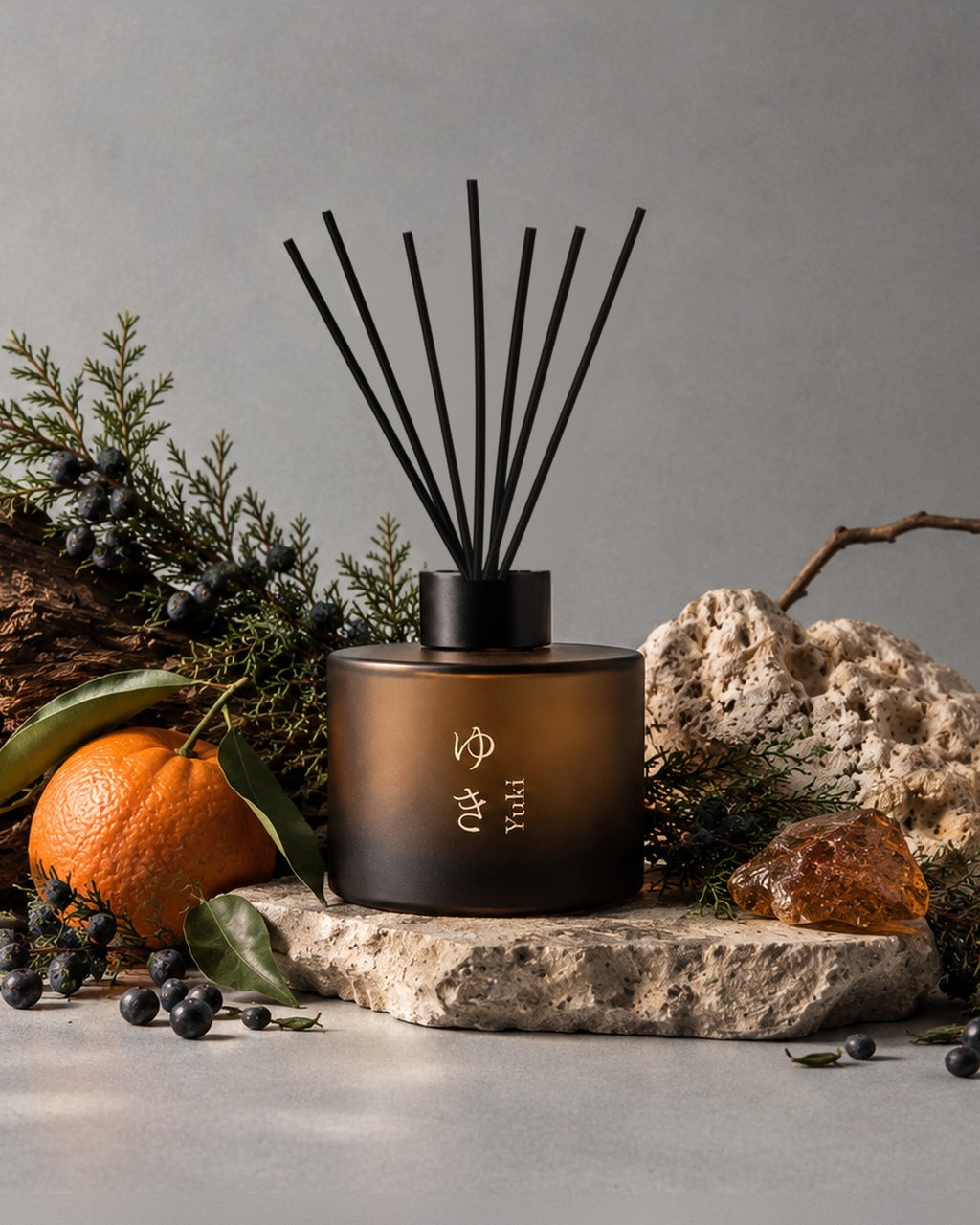 YUKI reed diffuser by Mittsu Doru styled with its scent notes – juniper sprigs and berries, mandarin and amber resin