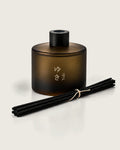 YUKI reed diffuser by Mittsu Doru – frosted amber bottle with black cap and black reeds